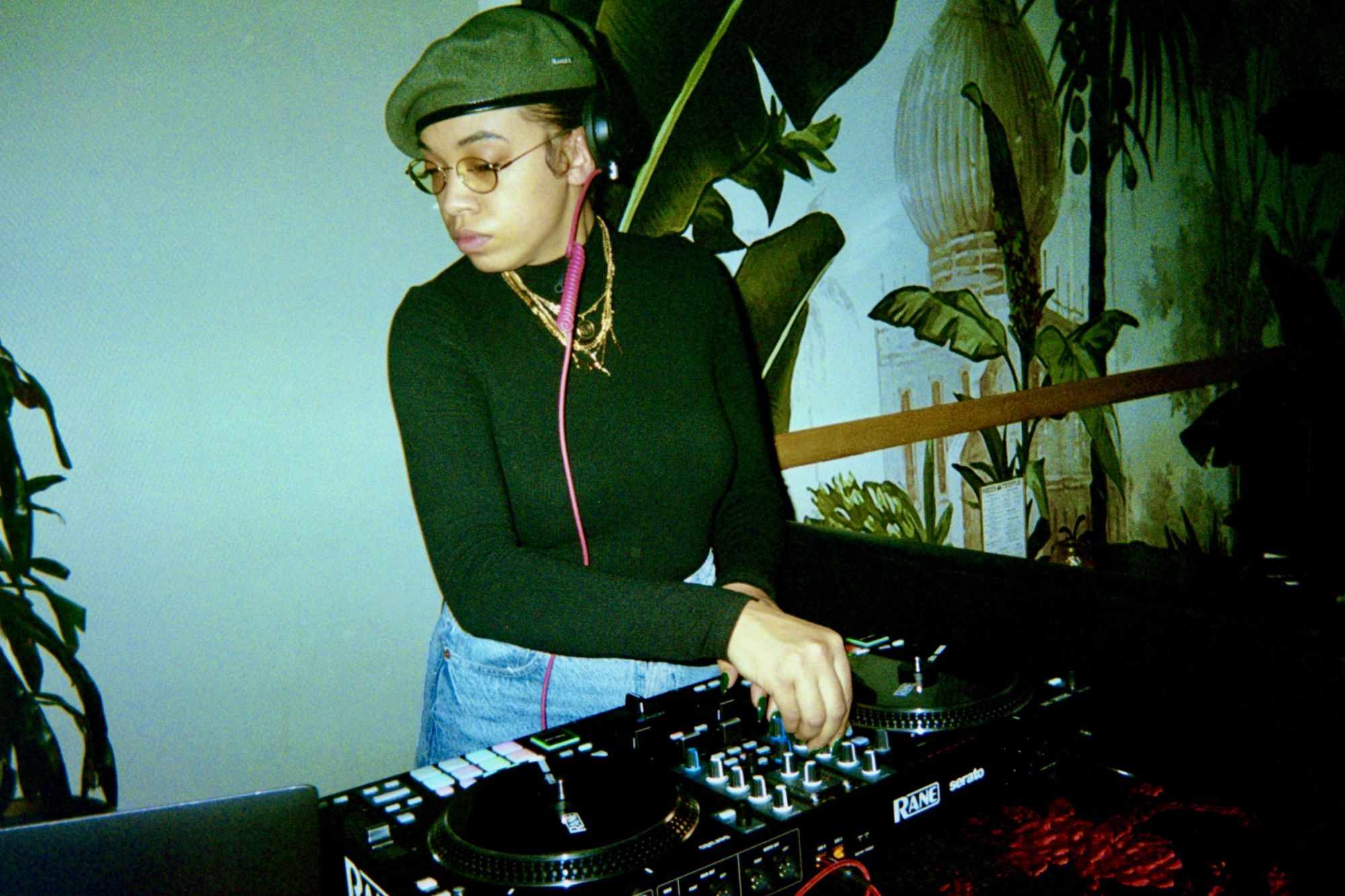 Lady CoCo DJing among the plants
