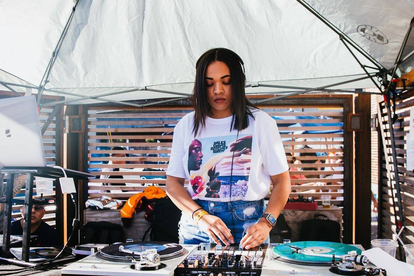 Lady CoCo on turntables at an outdoor event